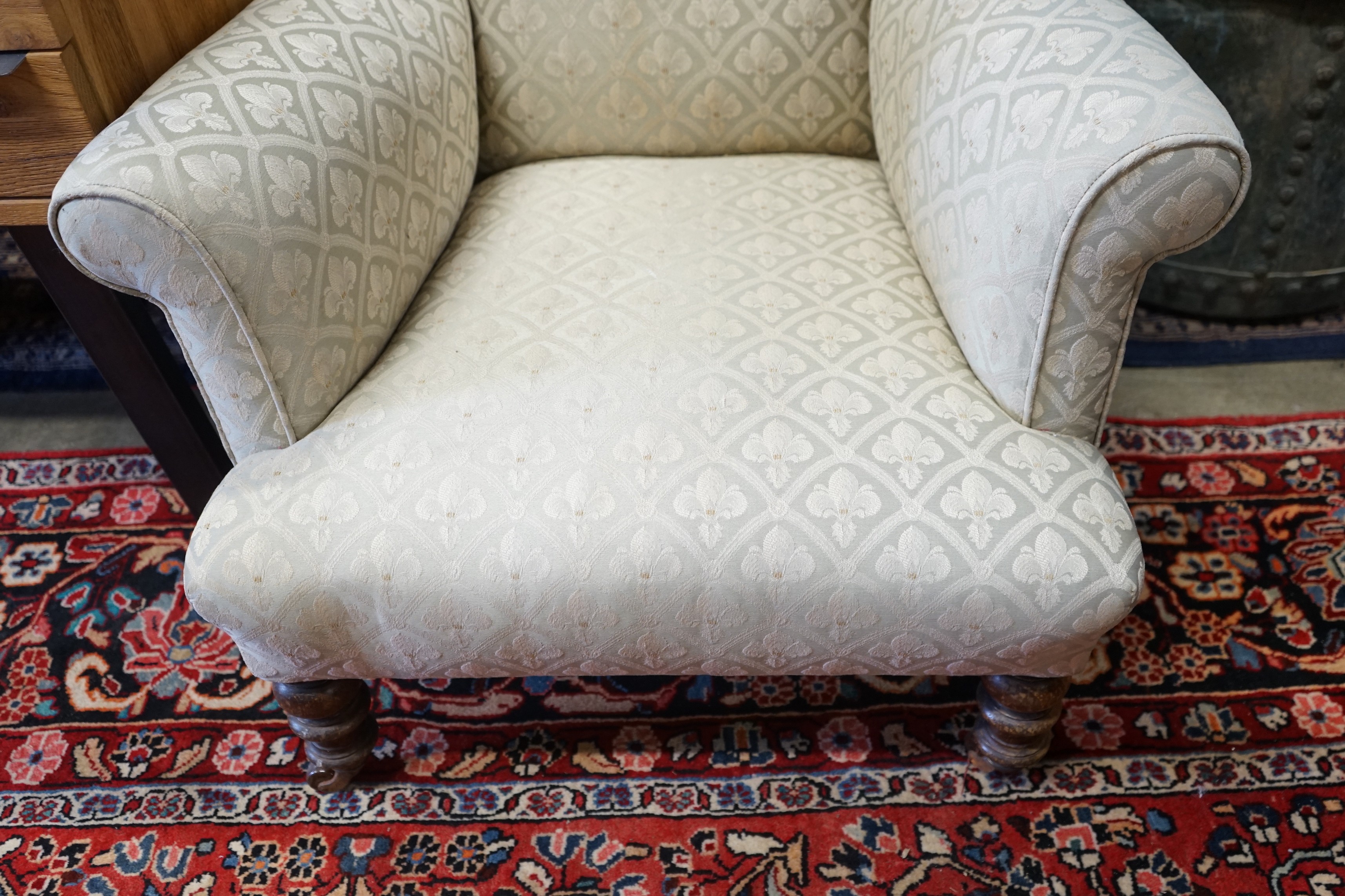 A Victorian upholstered wing armchair, width 76cm, depth 80cm, height 84cm